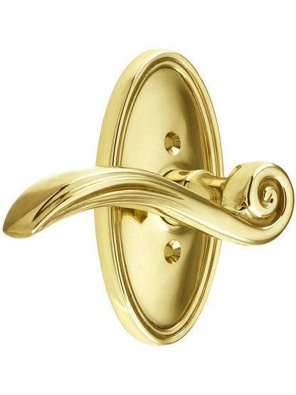 Oval Rosette Set With Elan Levers Left Hand in Polished Brass.